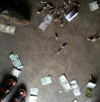 money and candy payments on the garage floor